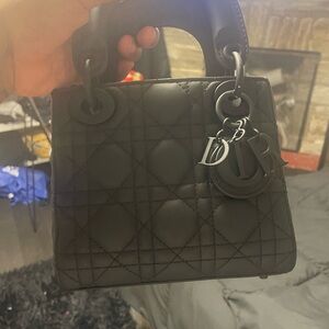 I am selling this mini black Christian Dior cross body bag.